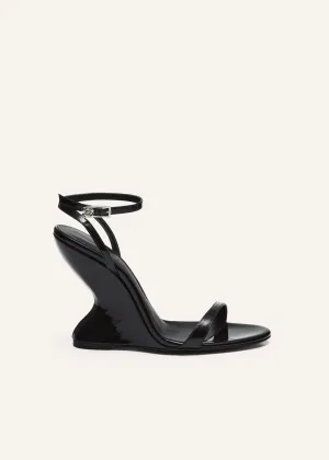 Inverted wedge strappy sandals in black patent leather