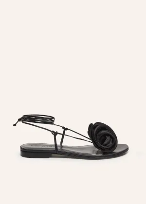 Wrap around flat flower sandals in black satin